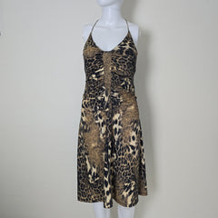 Leopard print dress on a mannequin against a plain background