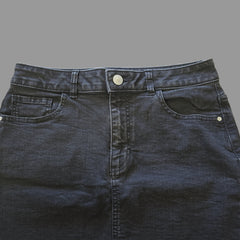 Dark grey denim fabric on a tiled floor