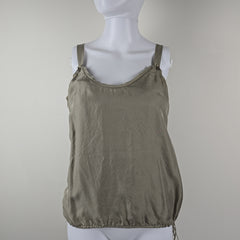 Grey tank top on a mannequin against a plain background