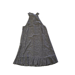 Grey and white spotted patterned dress on a light background