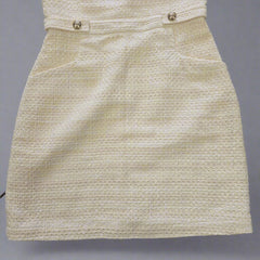 Beige textured fabric draped over a surface with a tiled background