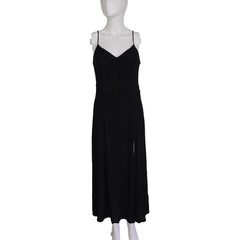 Black dress on a mannequin against a plain background