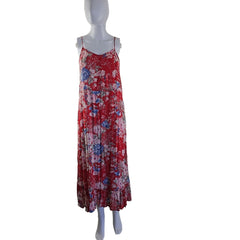 Red floral dress on a mannequin against a white wall.