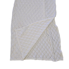 White textured dress on a light background.