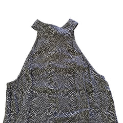 Grey and white spotted patterned dress on a light background