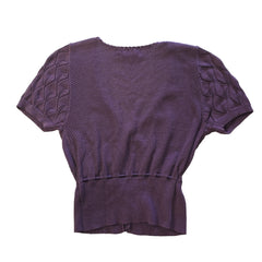 Purple textured top on a tiled floor