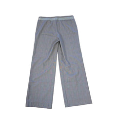 Pair of gray checkered pants on a tiled floor