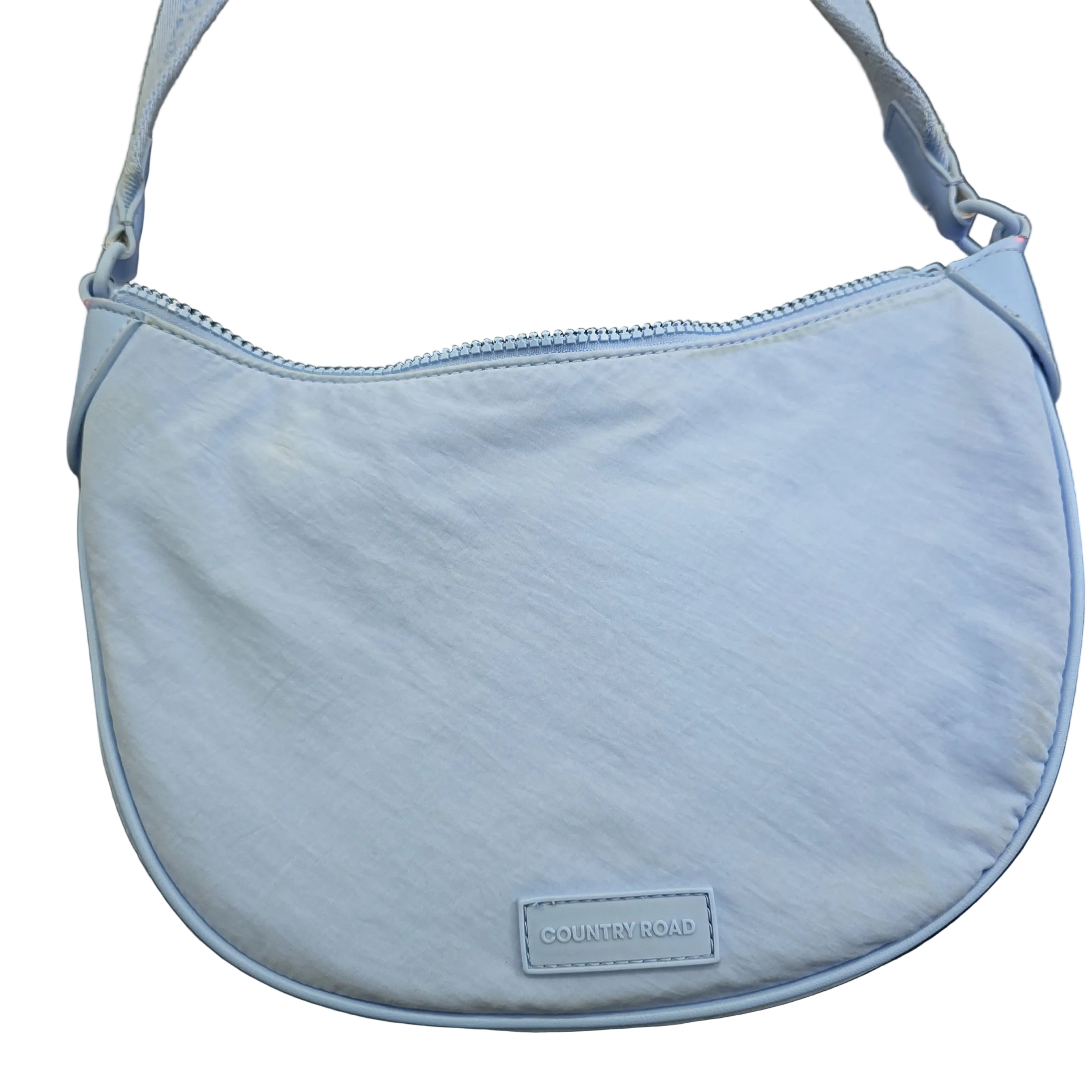 Light blue bag with a visible brand label on a light background