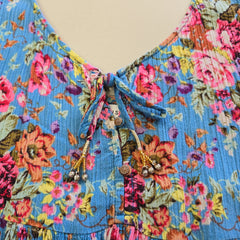 Blue floral top with on a light background