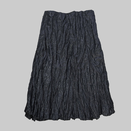 Folded black fabric on a tiled floor 2736