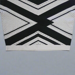 Black and white geometric patterned top on a tiled floor