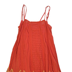 Orange dress with yellow embroidery on a light background