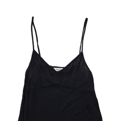 Black dress with beige lining on a light floor