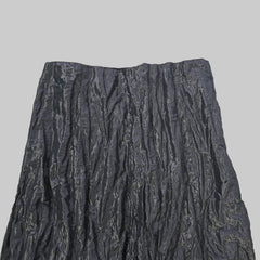 Black textured fabric on a tiled floor