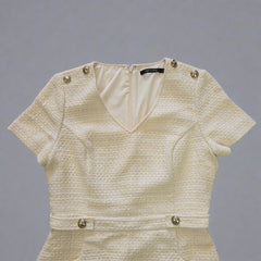 Beige textured Dress on a tiled floor