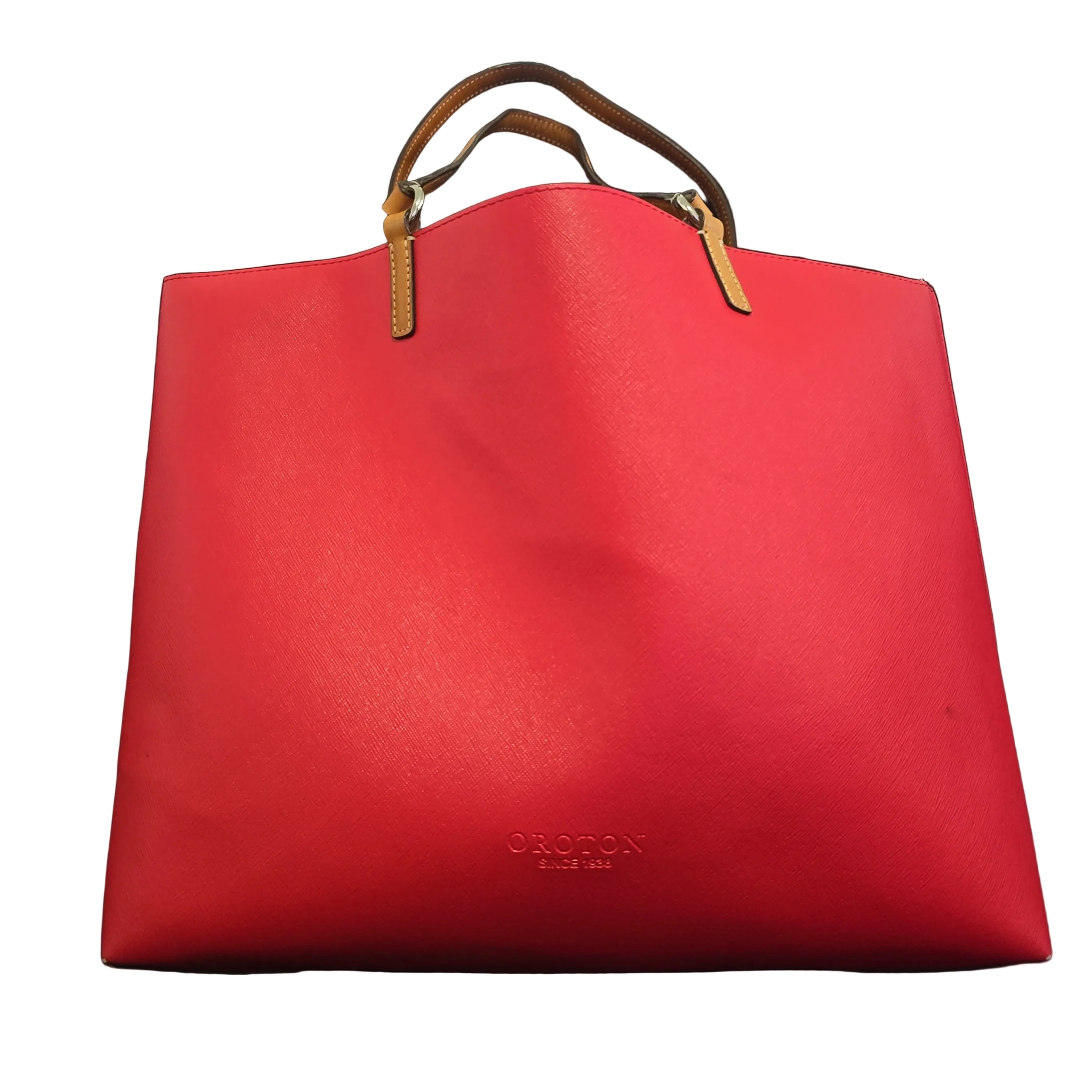 Red handbag with a visible brand logo on a light background