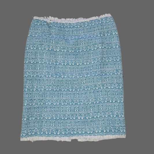 Blue textured skirt on a tiled floor 2736