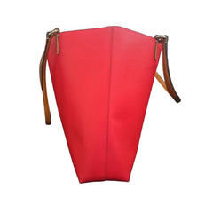 Red handbag with a visible brand logo on a light background