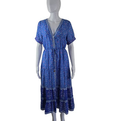 Blue patterned dress on a mannequin against a white background