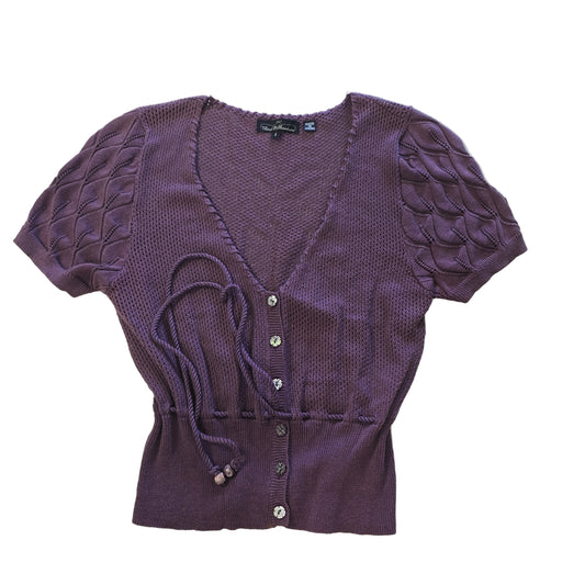 Purple textured garment on a tiled floor 2736