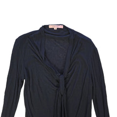 Black top with tie detail on a light background