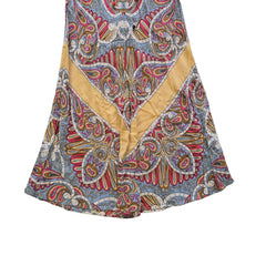 Colorful paisley-patterned fabric on a tiled floor