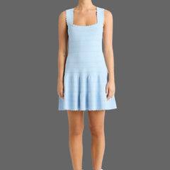Light blue dress worn by a model on a white background