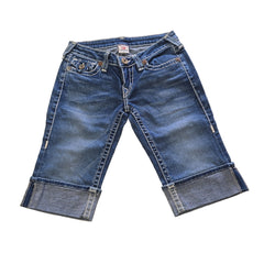 Pair of blue jean shorts on a light background