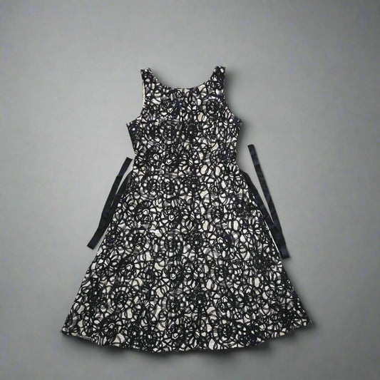 Black and white patterned dress on a tiled floor 1024