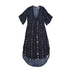 Black dress with white and pink patterns on a light background