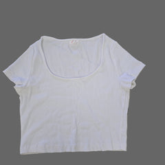 White t-shirt on a tiled floor