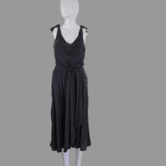Grey dress on a mannequin against a plain background