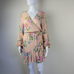 Floral dress on a mannequin against a plain background