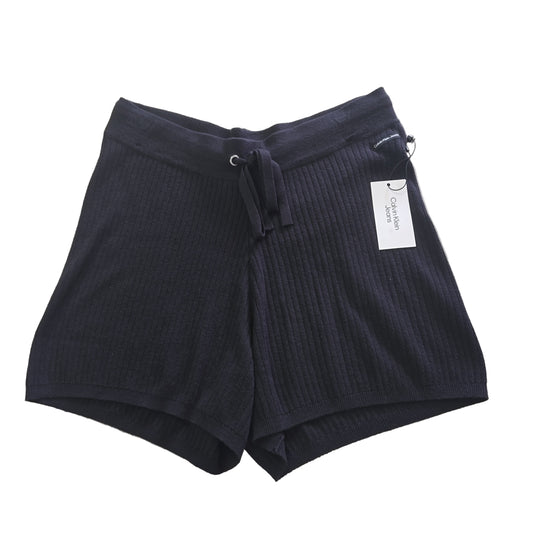 Black Cotton Shorts with a Calvin Klein label on a light background. 2736