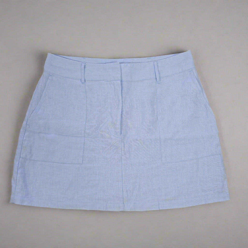 Light blue skirt on a beige background