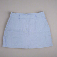 Light blue skirt on a beige background