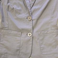 Gray striped jacket with button details on a light background
