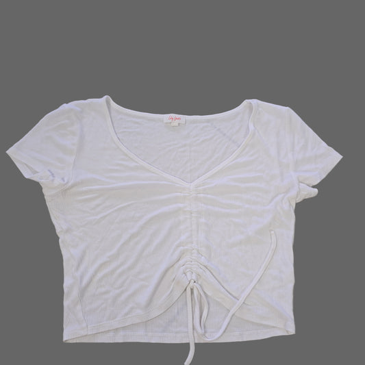 White sleeveless top on a tiled floor 2736