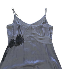 Grey dress with black floral patterns on a light background.