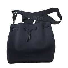 Black bucket bag with visible brand name on a light background