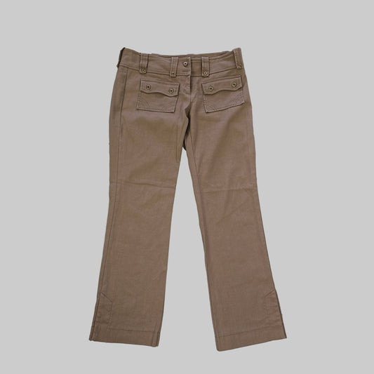 Brown pants on a white tiled floor 2736