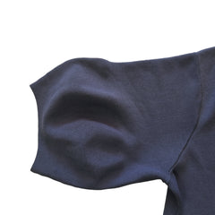 Dark blue fabric on a beige tiled floor