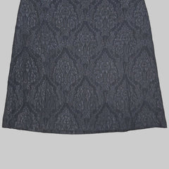 Black skirt on a tiled floor