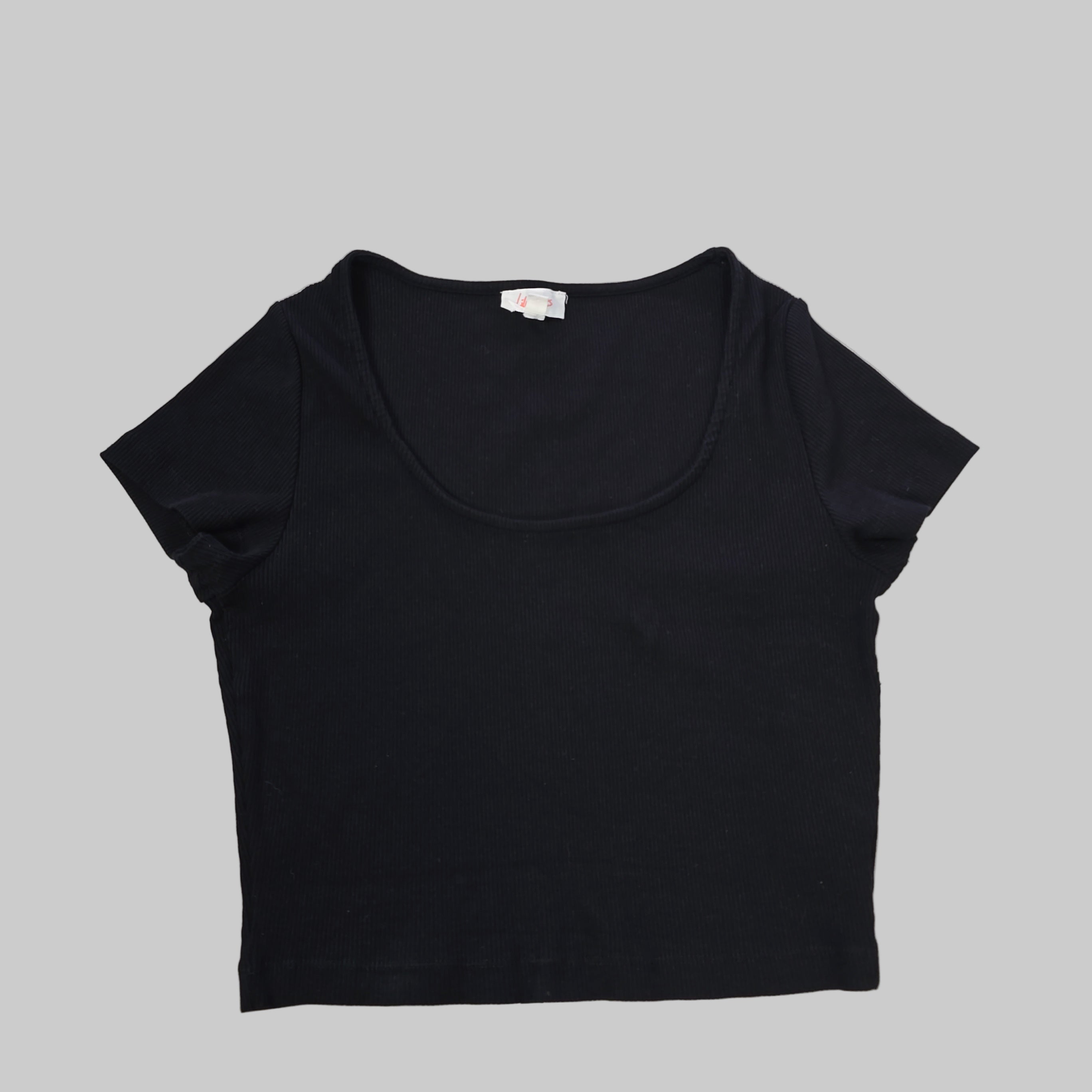 Black tank top on a tiled floor