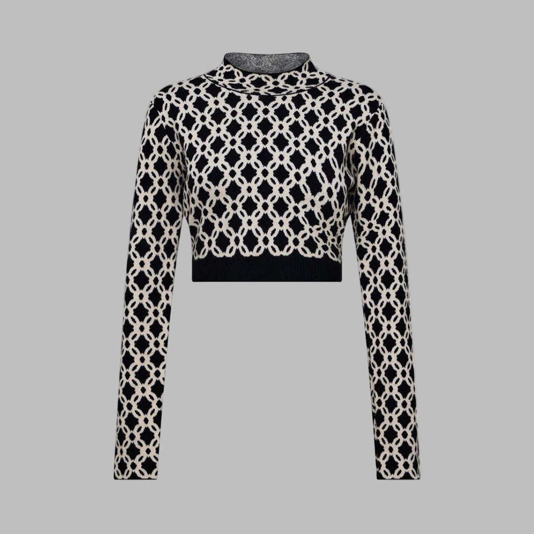 Black and white patterned top on a light gray background