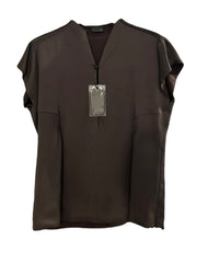 Brown sleeveless top with a tag on a white background