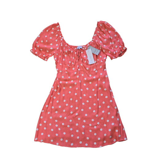 Pink polka dot dress on a tiled floor 2736