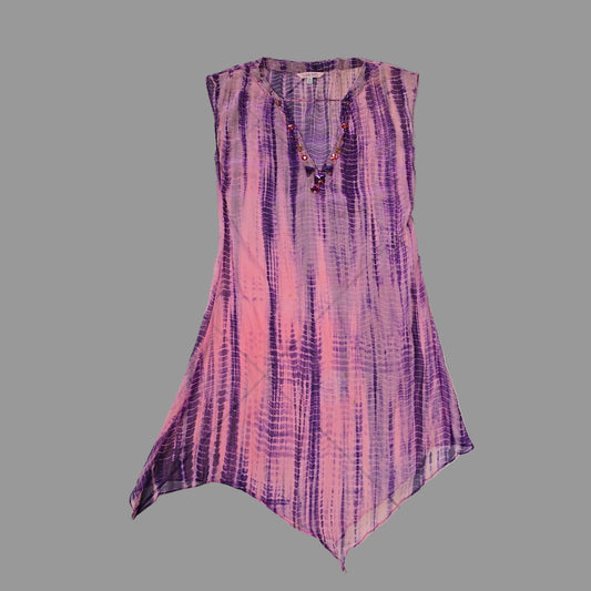 Purple and pink patterned kaftan on a tiled floor 2736