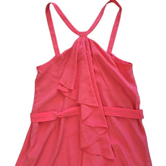 Pink dress with ruffled details on a light background