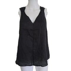 Black top on a mannequin against a beige background